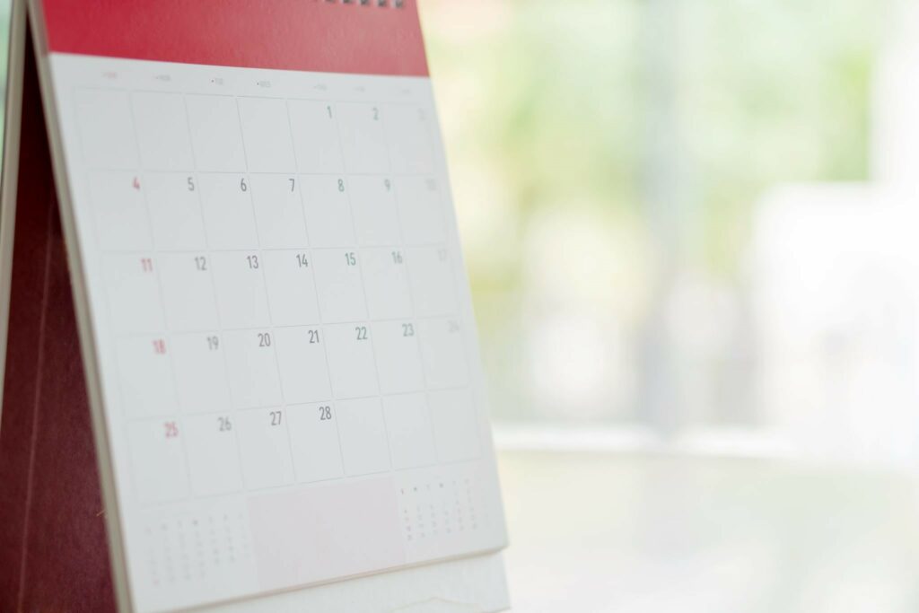 Calendar displayed on a desk showing days in a month