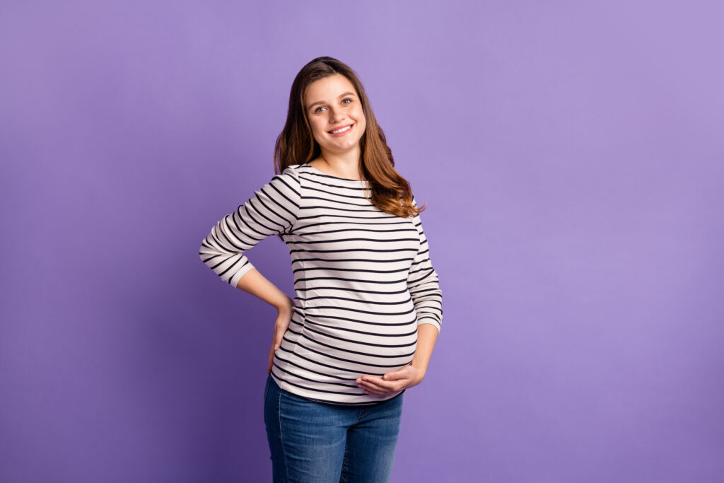 Smiling pregnant woman.