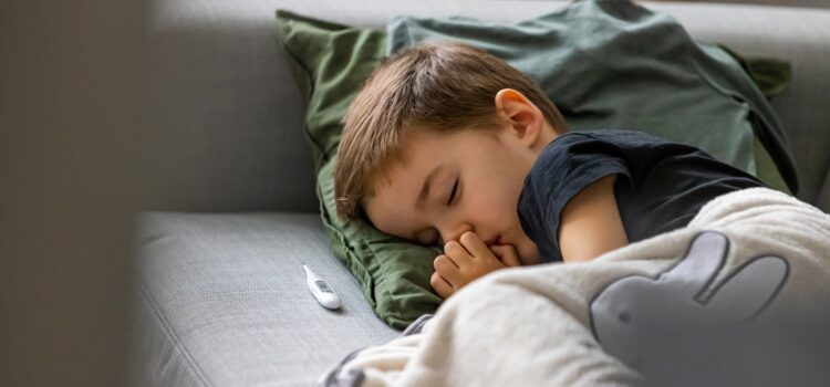 Young boy lying on a sofa