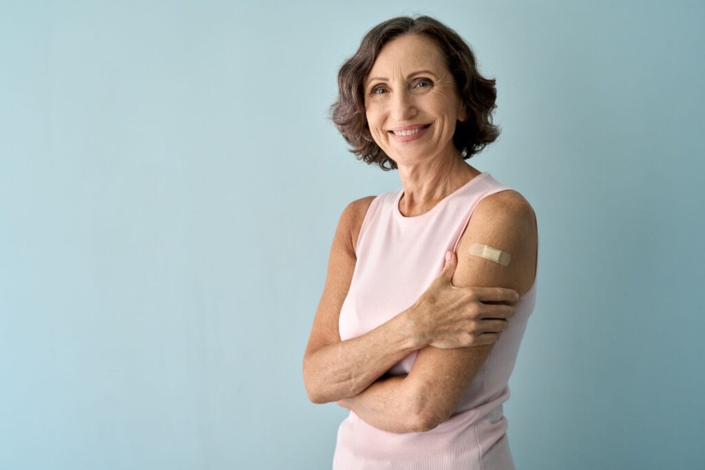 Older lady with a plaster on her arm