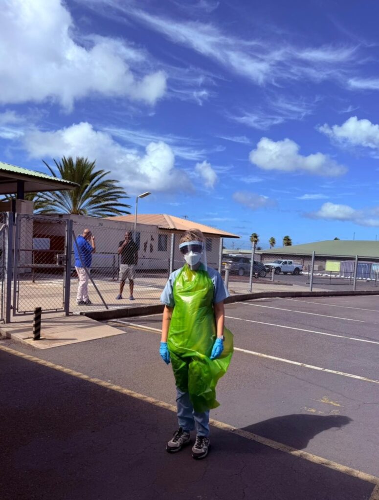 Renu in PPE waiting to receive passengers at Ascension Island